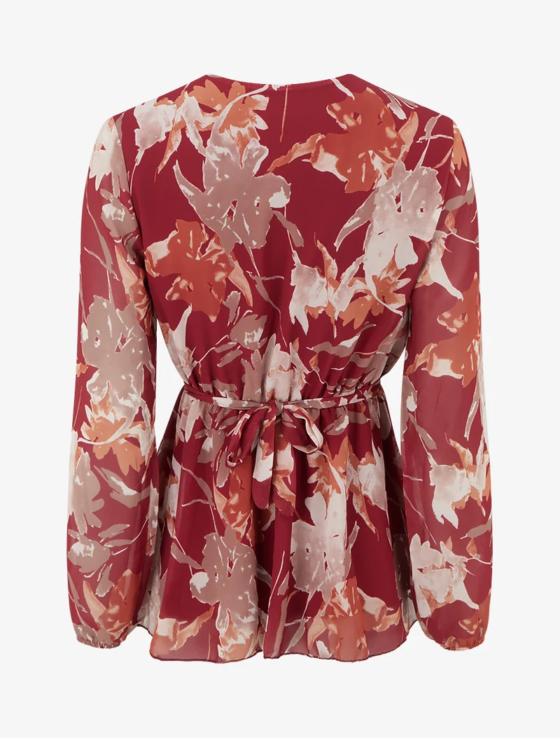 Top Wickelbluse mit abstraktem Blumenmuster und Blumenschmuck. - Rot