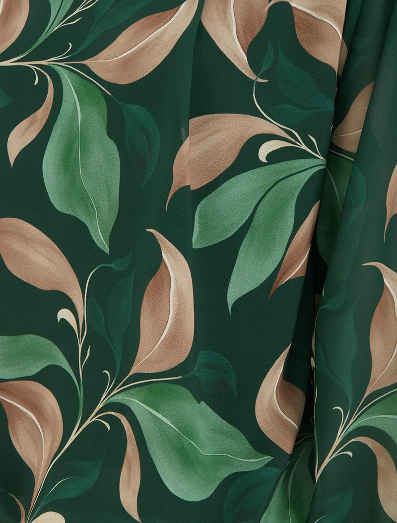 Bluse mit Blattdruck und elastischen Manschetten. - Tannengrün