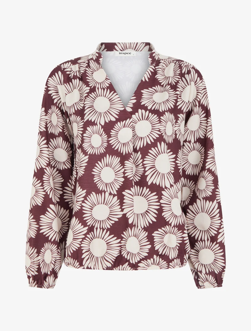 Bluse mit Blumenmuster und elastischen Bündchen. - Pflaume
