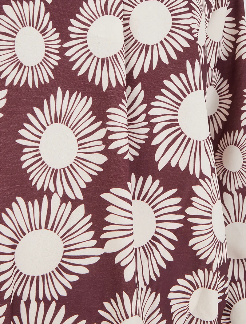 Bluse mit Blumenmuster und elastischen Bündchen. - Pflaume