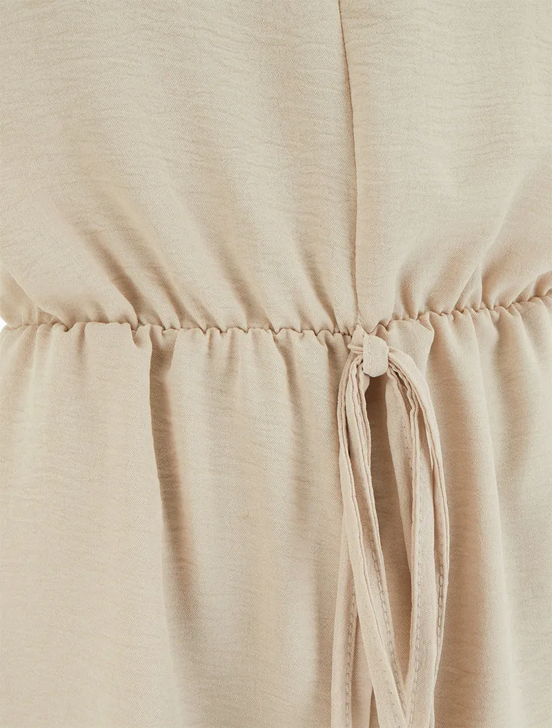 Einfarbiger Jumpsuit mit elastischer Taille - Beige