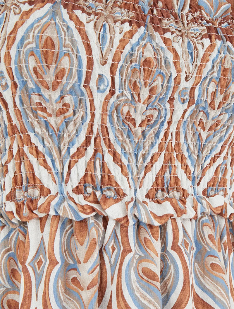 Langes Kleid mit Perlenriemchen und Fantasiemuster - Beige