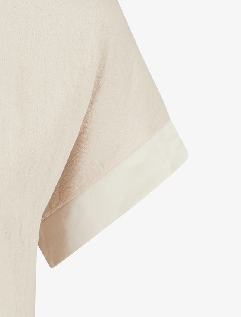 Kurzarm-Top mit Löwenzahn-Flockdruck und Schriftzug. - Beige