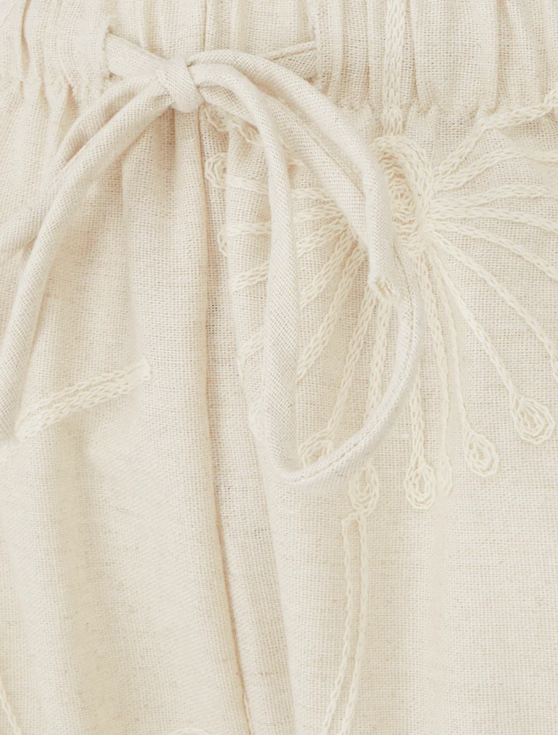 Weite Hose mit Blumenstickereien - Beige