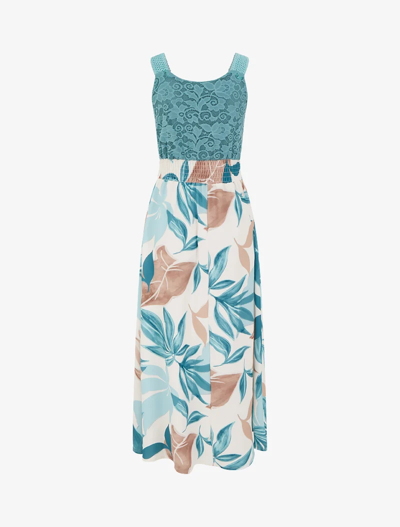 Kleid mit Fantasiemuster und Trägern aus Häkelarbeit. - Türkis