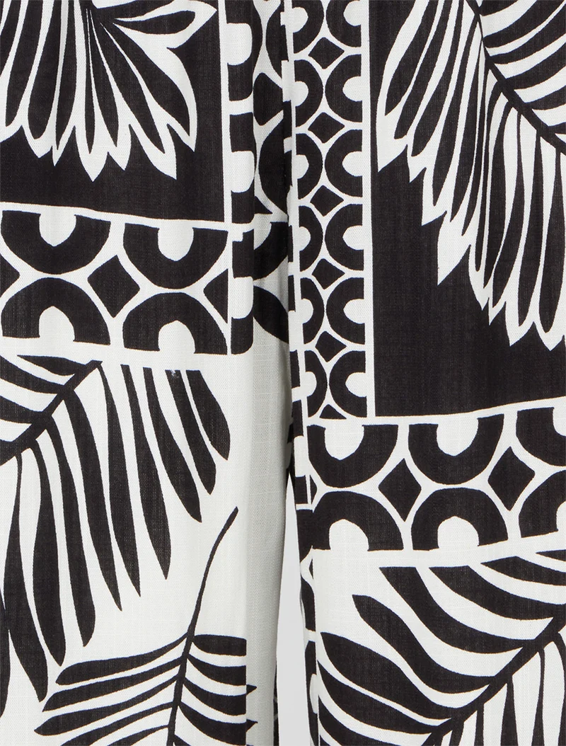 Weit geschnittene Hose mit Palmenblatt-Print - Schwarz