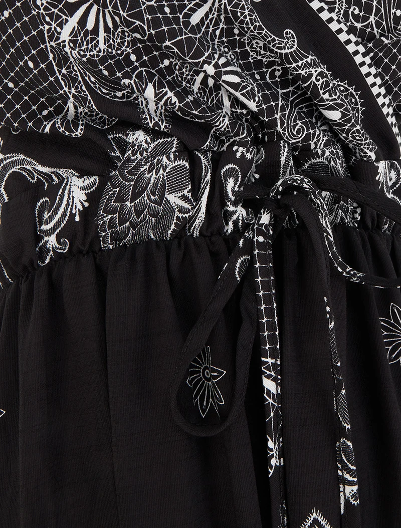 Langes Kleid mit arabesken Blumenmuster - Schwarz