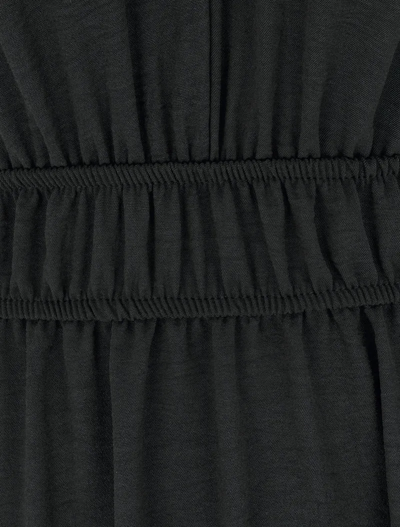 Einfarbiges Kleid mit Holzkugelbesatz - Schwarz