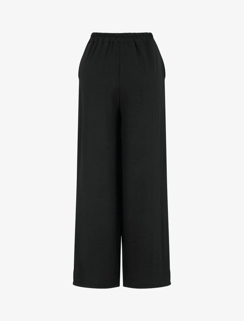 Weite Hose mit bestickten Kanten - Schwarz
