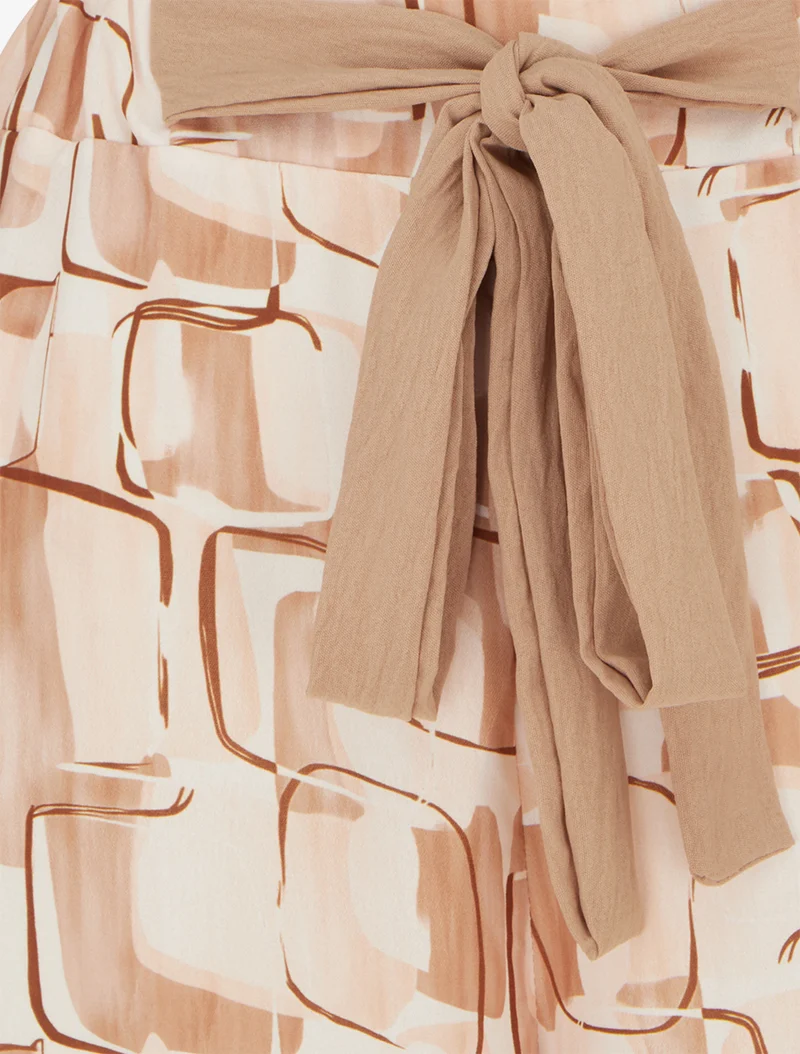 Weit geschnittene Hose mit grafischem Print. - Beige