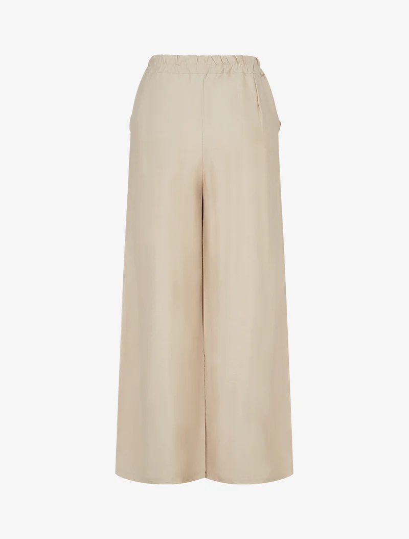 Weite einfarbige Hose mit dekorativen Knöpfen - Beige