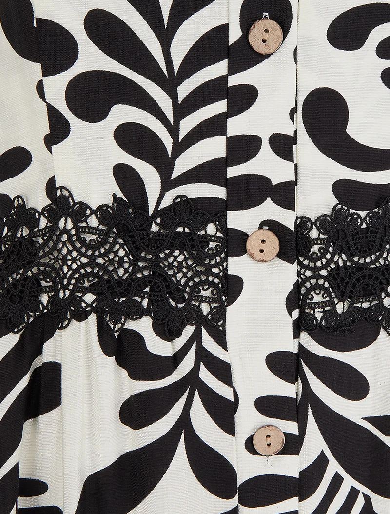 Ausgestelltes Kleid mit Fantasiemuster - Schwarz