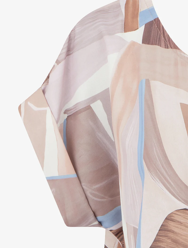 Abstrakt bedrucktes Bindetop. - Beige