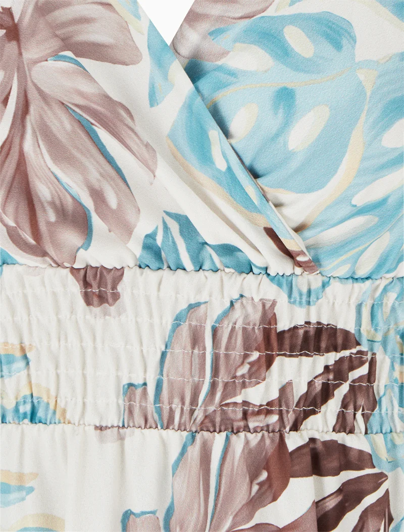 Langes Kleid mit schmalen Trägern und tropischem Print - Hellblau