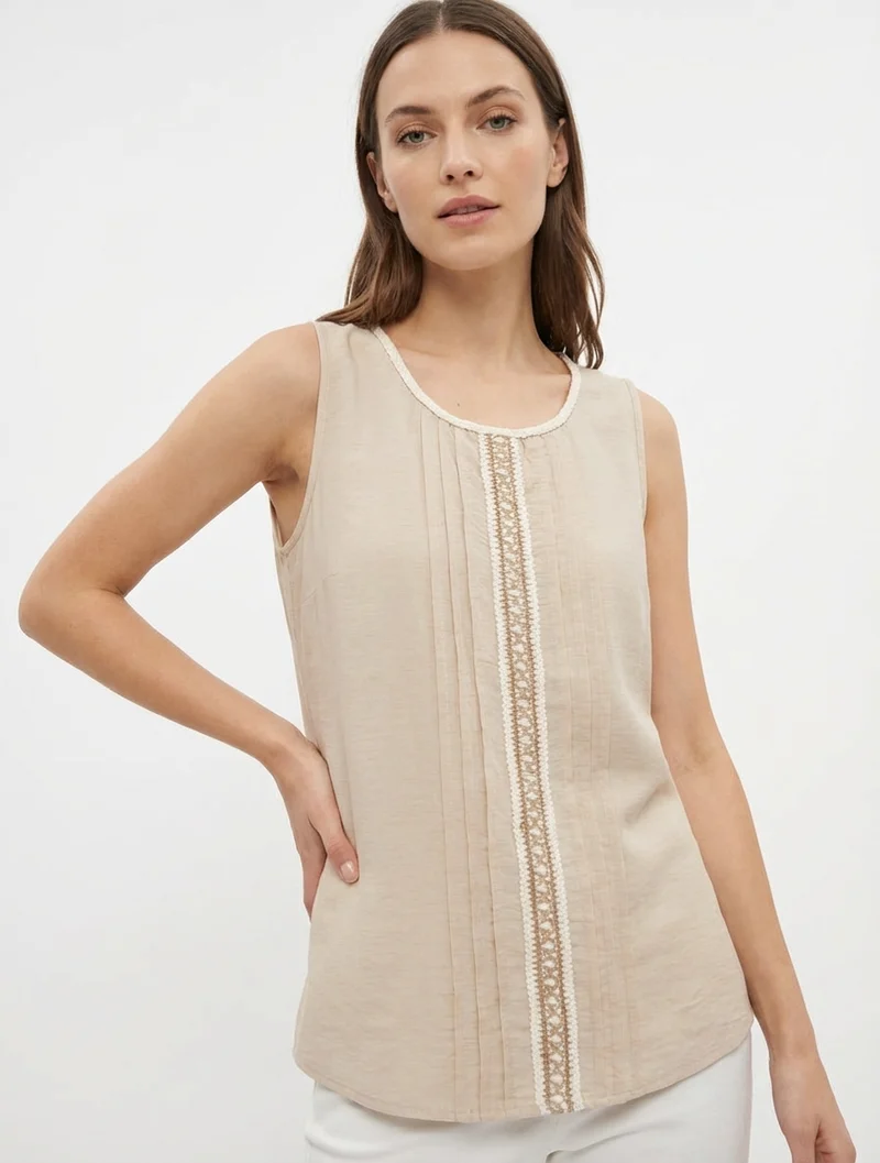 Ärmelloses Top mit Rundhalsausschnitt und Stickerei. - Beige