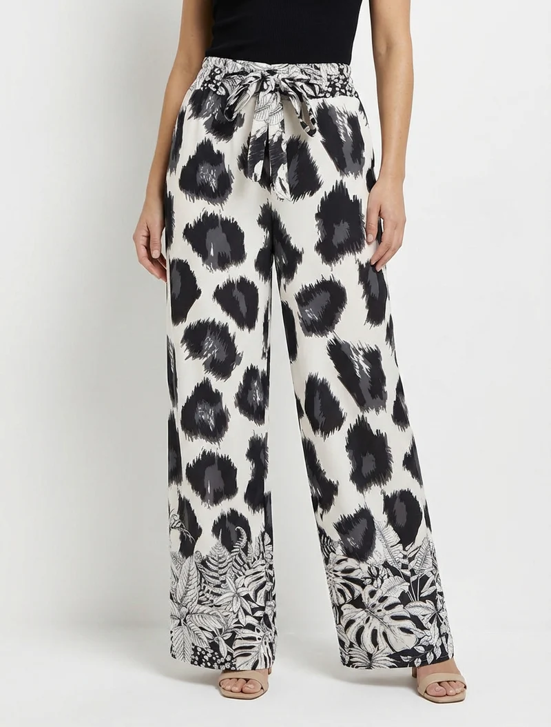 Weit geschnittene Hose mit fantasievollem Leopardenmuster - Schwarz