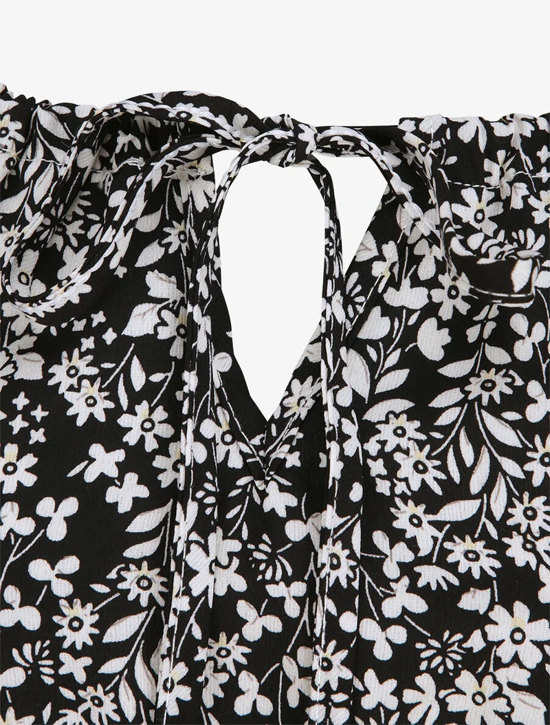 Langes Kleid mit Blumenmuster und bestickter Taille - Schwarz