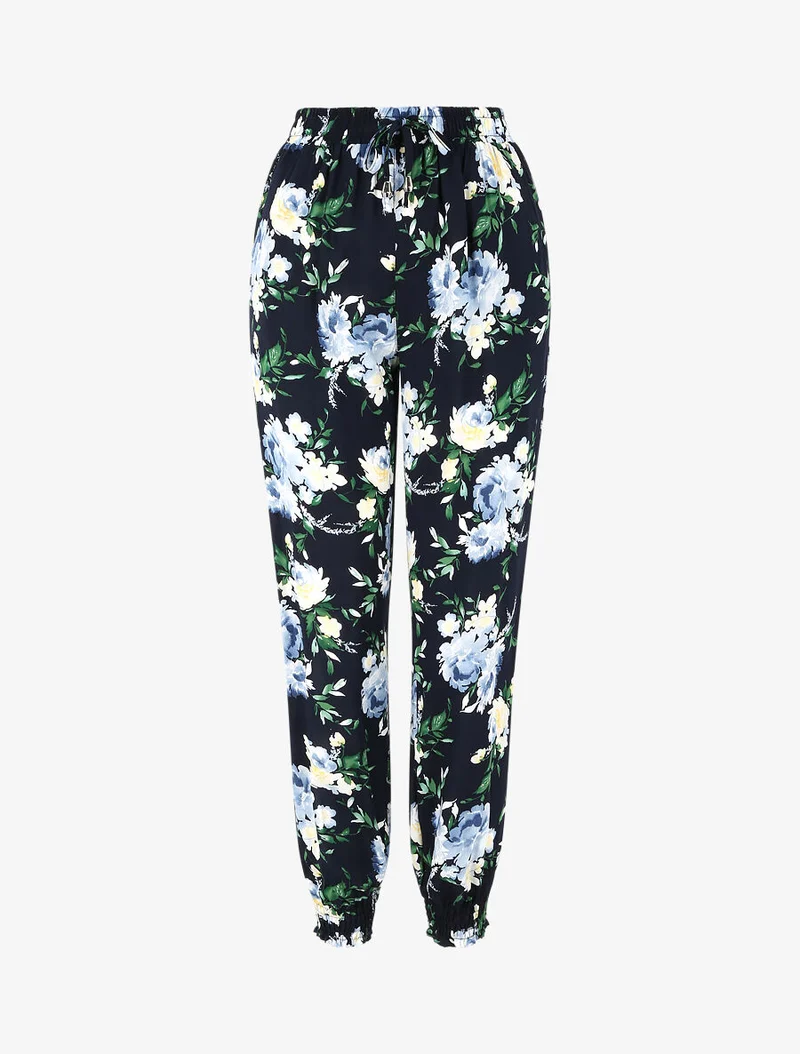 Fließende Hose mit Frühlingsblumenmuster und elastischen Säumen. - Marine
