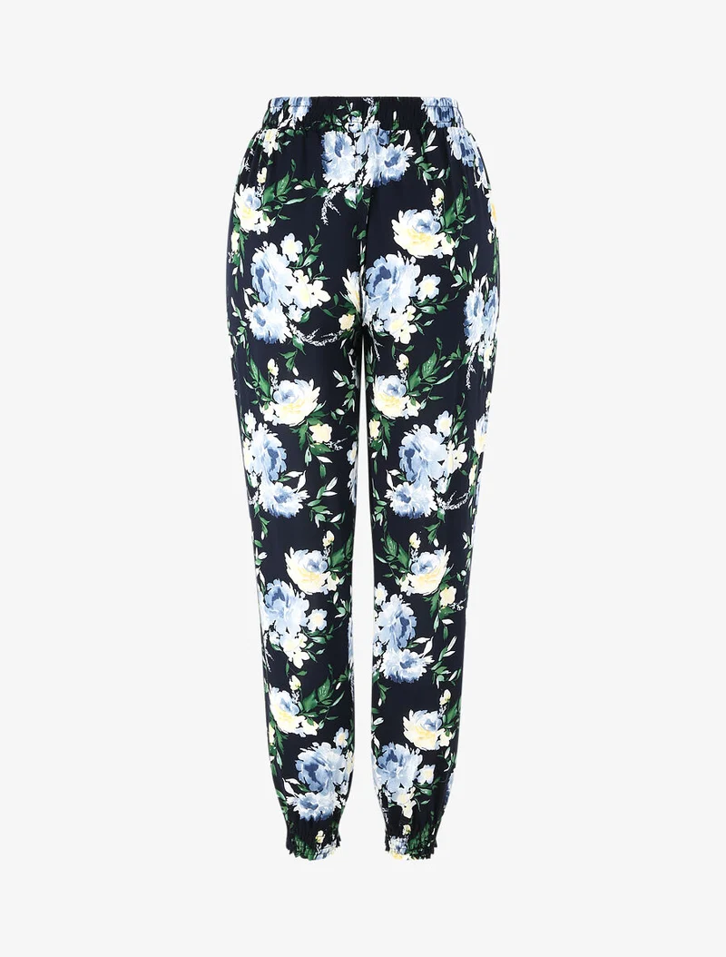 Fließende Hose mit Frühlingsblumenmuster und elastischen Säumen. - Marine