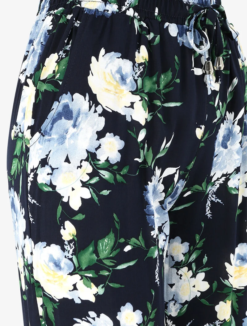 Fließende Hose mit Frühlingsblumenmuster und elastischen Säumen. - Marine