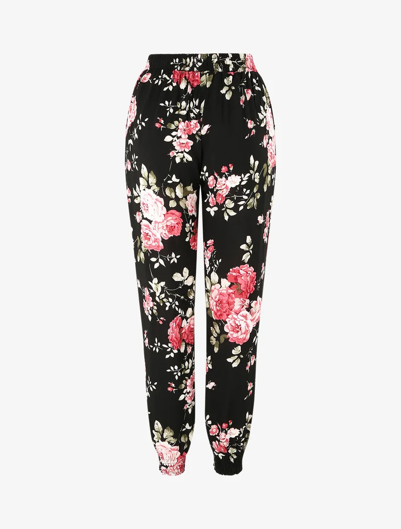 Fließende Hose mit Blumenmuster und elastischen Abschlüssen - Schwarz