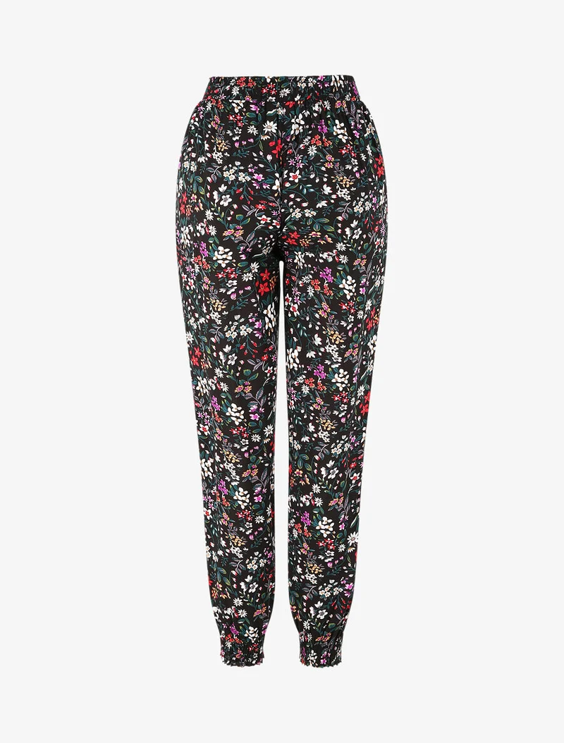Fließende Hose mit kleinem Blumenmuster und elastischen Bündchen - Schwarz