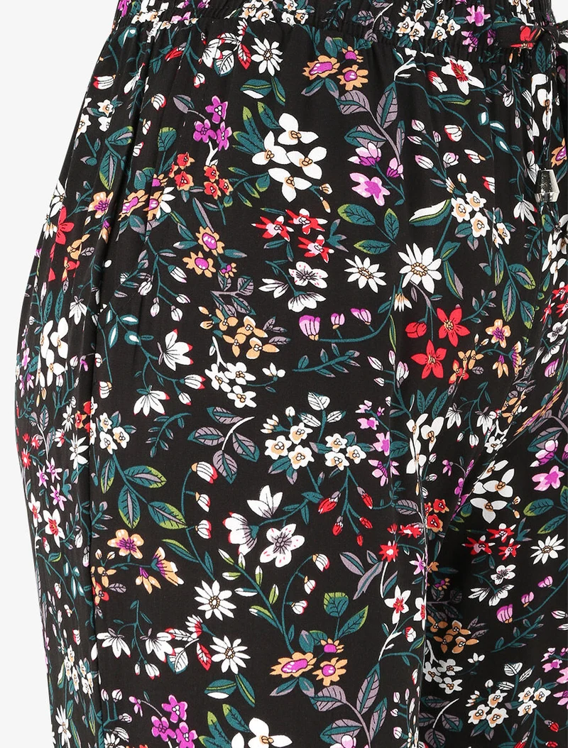 Fließende Hose mit kleinem Blumenmuster und elastischen Bündchen - Schwarz