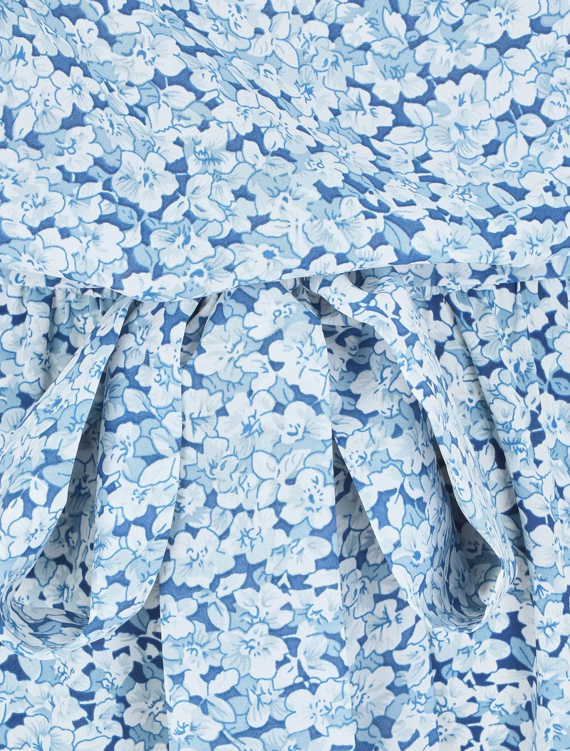 Fließender, geblümter Jumpsuit mit Flügelärmeln. - Blau