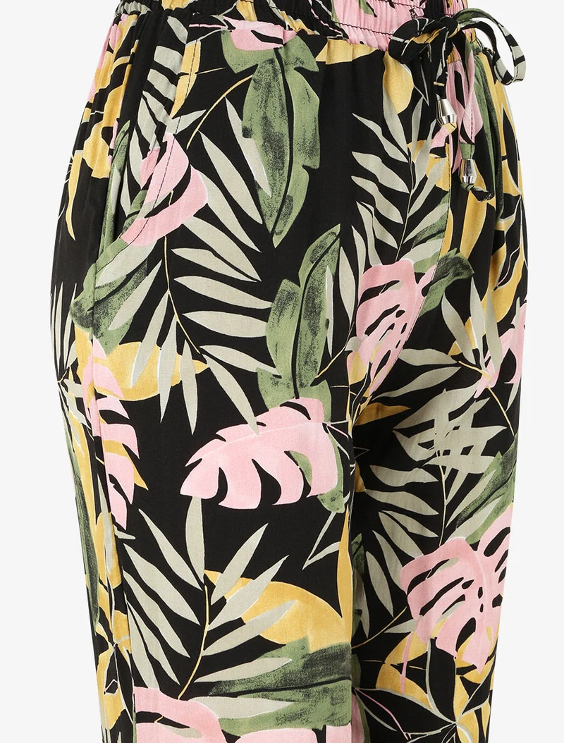 Fließende Hose mit tropischem Blumenmuster und elastischen Rändern - Schwarz