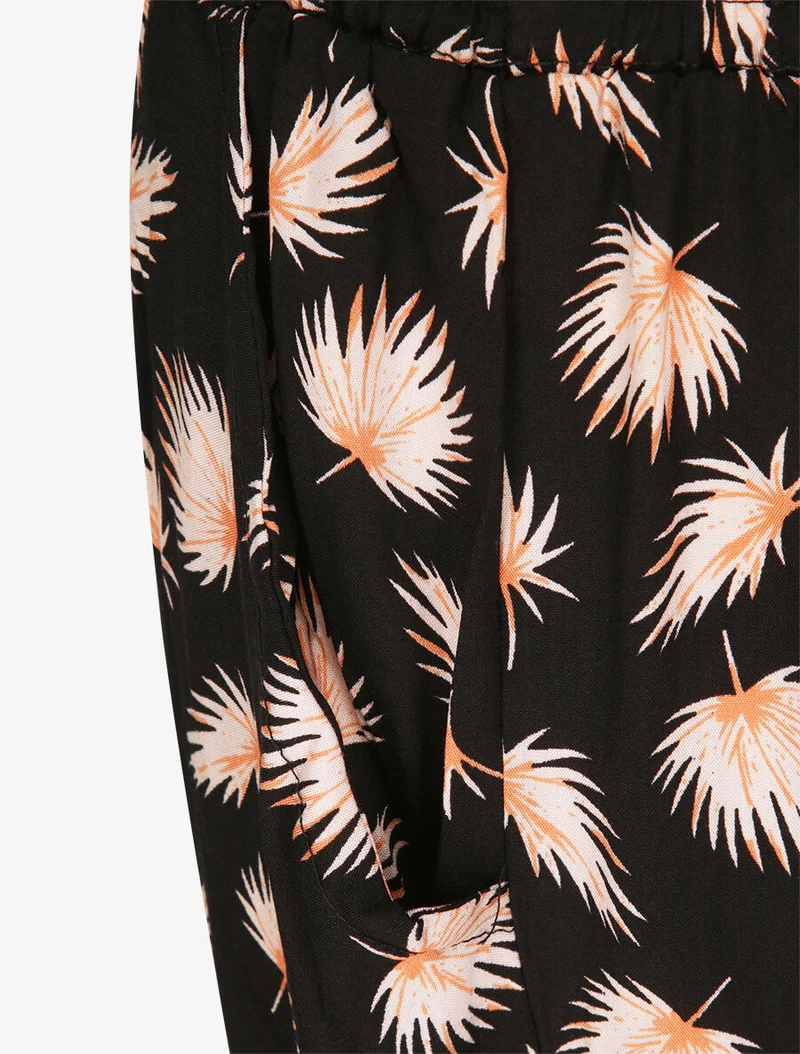 Haremshose mit Palmblätter-Print - Schwarz