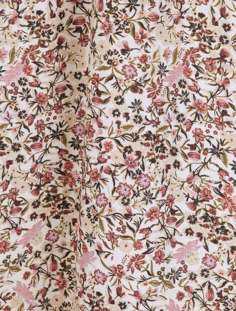 Langes Kleid mit kleinen Blumen bedruckt und V-Ausschnitt aus Spitze. - Beige