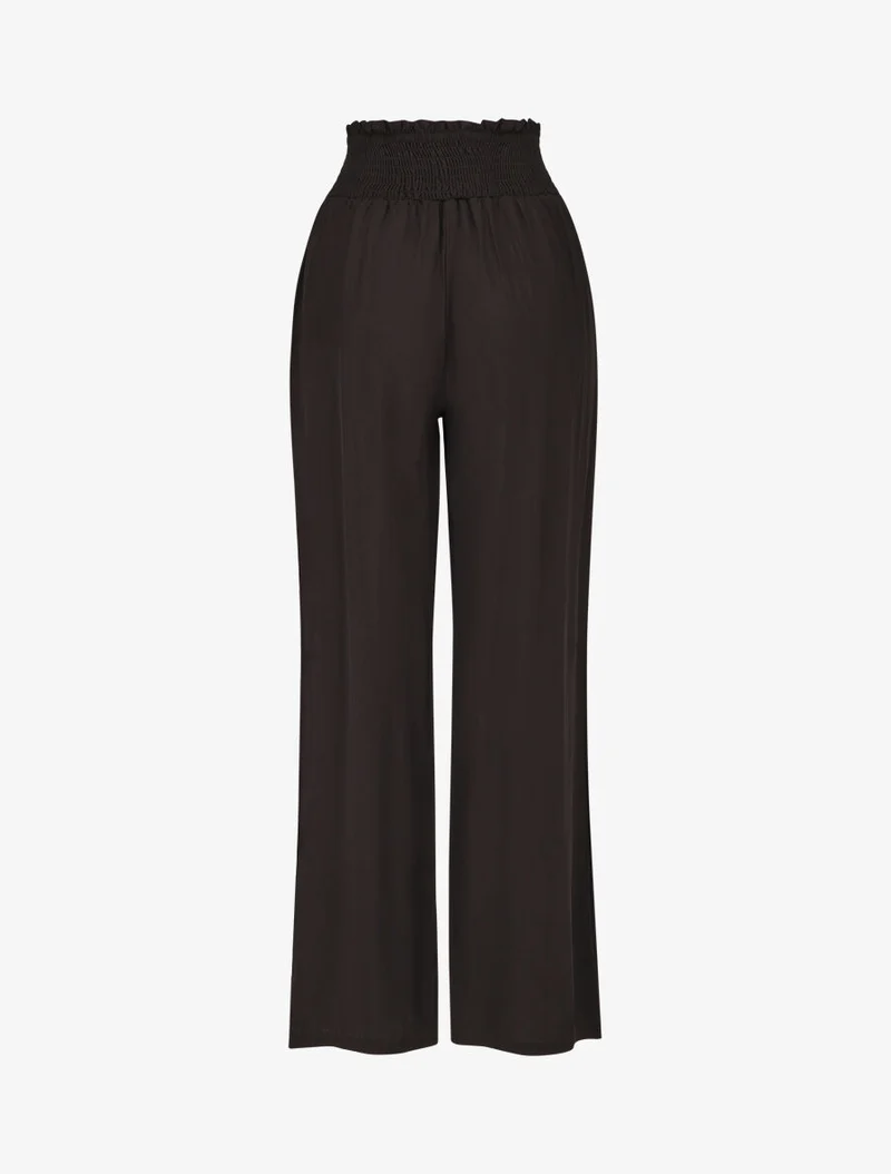 Einfarbige fließende Hose mit Taschen - Schwarz