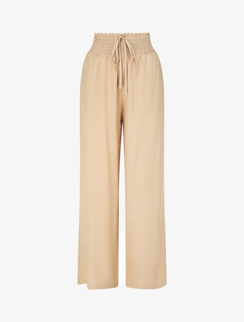Einfarbige fließende Hose mit Taschen - Beige