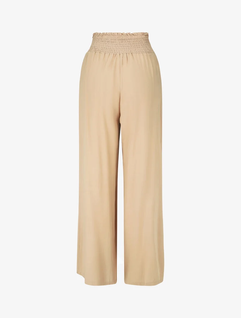Einfarbige fließende Hose mit Taschen - Beige