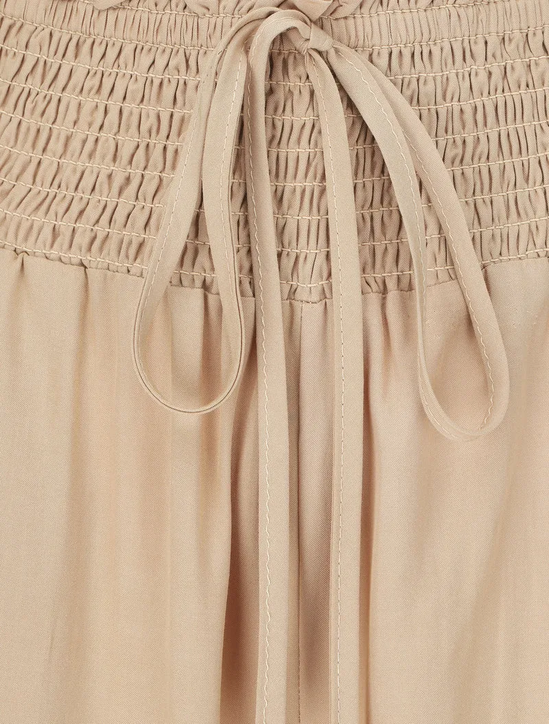 Einfarbige fließende Hose mit Taschen - Beige