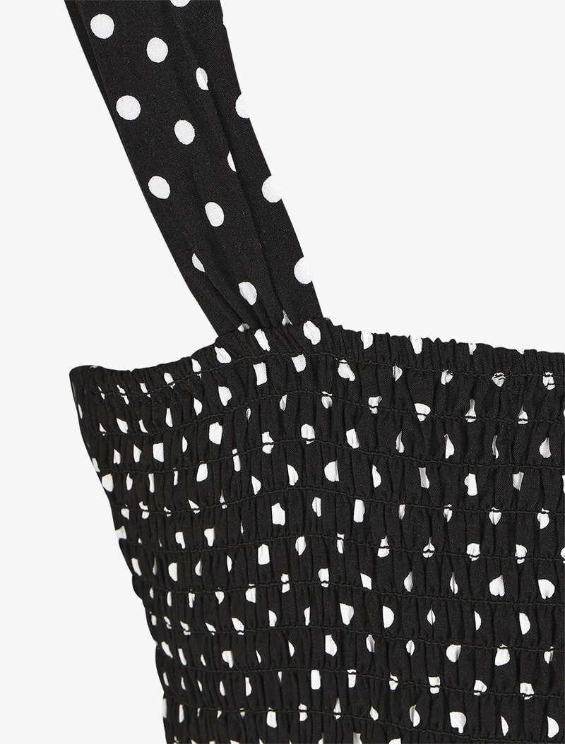 Ärmelloses langes gepunktetes Kleid - Schwarz
