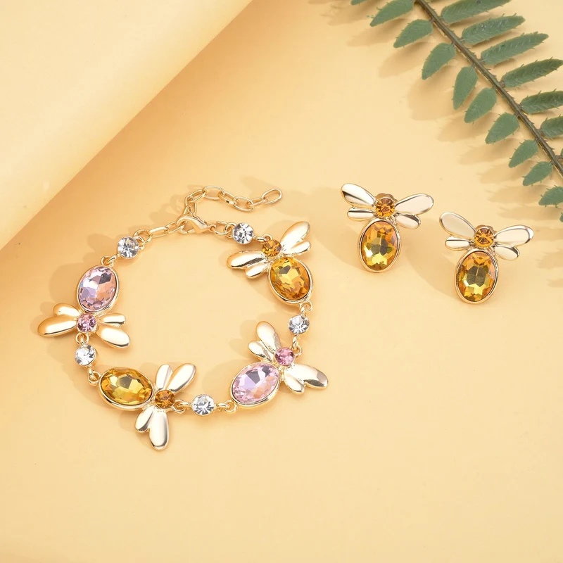 DESIGNER INSPIRIERT - 2er Set - Weißer Kristall Armband (ca. 19 cm + 5 cm Extender) und Ohrringe, goldfarben