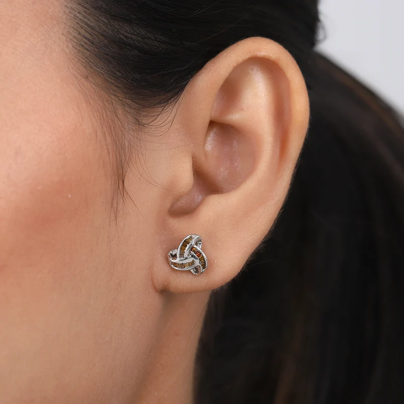 D'Joy blaue Diamant Liebesknoten Ohrstecker, 925 Silber platiniert - 0,25 ct.