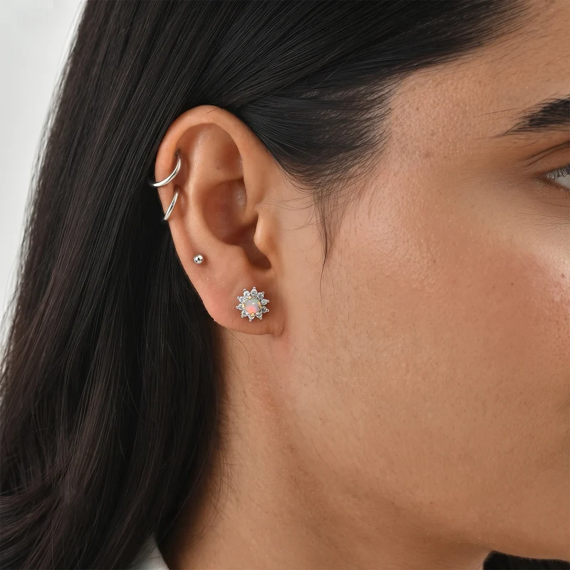 Tansanit und weiße Zirkon Ohrstecker, 925 Silber platiniert ca. 1.09 ct