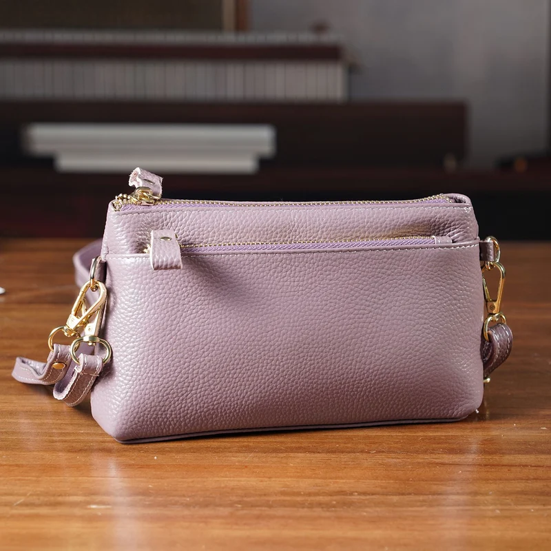 Leder Crossbody Tasche mit mehreren Reißverschlussfächern und verstellbarem Schulterriemen 21.5 x 4 x 13 cm Violett