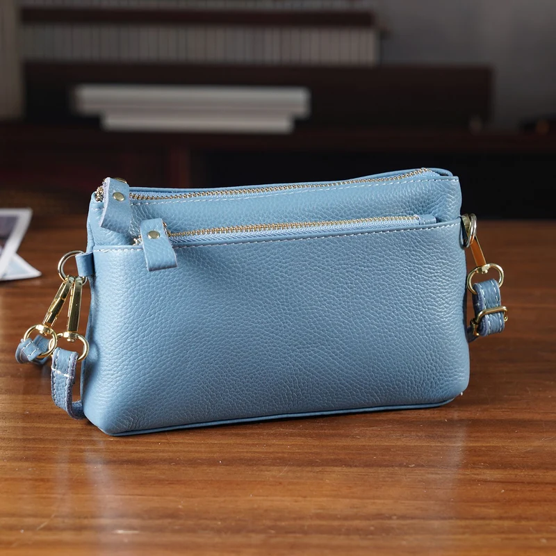Leder Crossbody Tasche mit mehreren Reißverschlussfächern und verstellbarem Schulterriemen 21.5 x 4 x 13 cm Violett